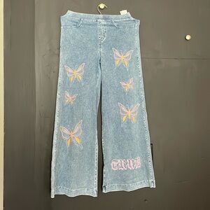 Jeans with butterfly and lettering